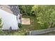 View of a white siding home with a new wooden deck and backyard at 4213 Stoneford Trace Dr, Raleigh, NC 27616