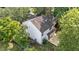 An aerial view shows the home's new wooden deck and trees surrounding the back yard at 4213 Stoneford Trace Dr, Raleigh, NC 27616