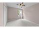Bedroom with neutral walls, carpet, ceiling fan and a window with curtains at 4213 Stoneford Trace Dr, Raleigh, NC 27616