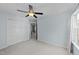 Bedroom with neutral walls, carpet, ceiling fan and a double door closet at 4213 Stoneford Trace Dr, Raleigh, NC 27616