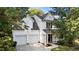 Charming two-story home featuring a two-car garage, neutral siding, and manicured landscaping at 4213 Stoneford Trace Dr, Raleigh, NC 27616