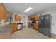 Traditional kitchen featuring stainless steel appliances and granite countertops with wood cabinets at 4213 Stoneford Trace Dr, Raleigh, NC 27616