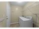Laundry room featuring a standard washing machine, dryer and metal shelving units for ample storage at 4213 Stoneford Trace Dr, Raleigh, NC 27616