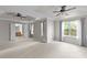 Spacious main bedroom with tray ceilings, carpet floors, and views of the ensuite bathroom at 4213 Stoneford Trace Dr, Raleigh, NC 27616