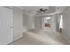 This primary bedroom features carpet flooring, a ceiling fan, and an ensuite bathroom at 4213 Stoneford Trace Dr, Raleigh, NC 27616