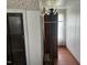 Hallway with wood floors and storage at 45 Perkinson St, Kittrell, NC 27544