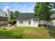 This home has a private backyard with green grass, offering a serene outdoor space at 5006 Silhouette Dr, Durham, NC 27713