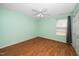 Simple and serene bedroom with ceiling fan and natural light at 5006 Silhouette Dr, Durham, NC 27713