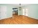 Bright dining area with wood floors and access to kitchen and outdoor patio at 5006 Silhouette Dr, Durham, NC 27713