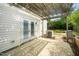 Shaded back patio with a pergola and access to the home at 5006 Silhouette Dr, Durham, NC 27713