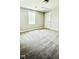 A cozy bedroom featuring neutral walls, plush carpeting, and a bright window at 505 E Canary St, Dunn, NC 28334