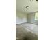 A spacious bedroom featuring neutral walls, plush carpeting, and a ceiling light at 505 E Canary St, Dunn, NC 28334