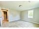 Bedroom with light-colored walls and carpet, featuring a bright window at 505 E Canary St, Dunn, NC 28334