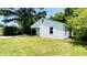 Quaint single-story home featuring white siding and a well-maintained lawn at 505 E Canary St, Dunn, NC 28334