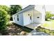 Comfortable covered front porch with ceiling light and mailbox at 505 E Canary St, Dunn, NC 28334