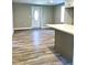 Open floor plan with kitchen island and new floors at 505 E Canary St, Dunn, NC 28334