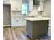 Stylish kitchen featuring a functional island, stainless steel appliances, and modern countertops at 505 E Canary St, Dunn, NC 28334