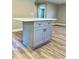 Kitchen island with storage cabinets, drawers, and a white countertop at 505 E Canary St, Dunn, NC 28334