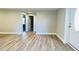 View of bright living room showcasing adjacent doors and modern light gray walls at 505 E Canary St, Dunn, NC 28334