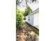 Side view of home with white siding and access to concrete parking area at 505 E Canary St, Dunn, NC 28334