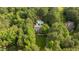 Stunning aerial view of a private estate featuring a pool surrounded by lush greenery at 5344 Mill Dam Rd, Wake Forest, NC 27587