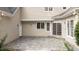 Spacious back patio with stone pavers, access door and sliding glass door at 5344 Mill Dam Rd, Wake Forest, NC 27587