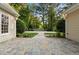 Stylish backyard with a stone patio leading to the pool, perfect for outdoor entertaining at 5344 Mill Dam Rd, Wake Forest, NC 27587