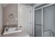 Bathroom featuring a single vanity, sliding glass shower doors and neutral wall color at 5344 Mill Dam Rd, Wake Forest, NC 27587