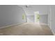 A neutral bedroom featuring carpet, a ceiling fan, and three windows for plenty of natural light at 5344 Mill Dam Rd, Wake Forest, NC 27587