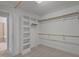 This spacious walk-in closet includes ample shelving and hanging rods to help keep everything organized at 5344 Mill Dam Rd, Wake Forest, NC 27587