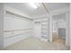 Well-organized walk-in closet with ample hanging and shelving space to maximize storage at 5344 Mill Dam Rd, Wake Forest, NC 27587