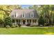 Charming home featuring a welcoming front porch and a beautifully landscaped front yard at 5344 Mill Dam Rd, Wake Forest, NC 27587