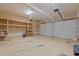Spacious garage with ample storage shelves and two white garage doors at 5344 Mill Dam Rd, Wake Forest, NC 27587