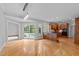 Open floor plan kitchen and eat in area leading to the pool with stainless steel appliances and wooden cabinets at 5344 Mill Dam Rd, Wake Forest, NC 27587