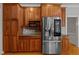 Kitchen featuring wood cabinets, stainless steel appliances, microwave and refrigerator at 5344 Mill Dam Rd, Wake Forest, NC 27587