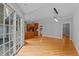 Bright and spacious living room featuring hardwood floors and large windows, with backyard access at 5344 Mill Dam Rd, Wake Forest, NC 27587