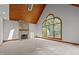 Bright living room with stone fireplace, wood-paneled ceiling, and large window at 5344 Mill Dam Rd, Wake Forest, NC 27587