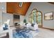 Bright, staged living room with stone fireplace, wood-paneled ceiling, and large window at 5344 Mill Dam Rd, Wake Forest, NC 27587