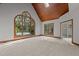 Spacious bedroom featuring a vaulted wood ceiling, large window overlooking the pool, and neutral carpet at 5344 Mill Dam Rd, Wake Forest, NC 27587