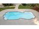 Aerial view of private pool with a concrete surround and manicured landscaping at 5344 Mill Dam Rd, Wake Forest, NC 27587