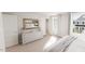 Spacious bedroom with modern furniture, natural light from large windows, and neutral-toned decor at 537 Folk Song Way, Wendell, NC 27591