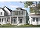 Charming two-story home featuring a covered front porch and professionally landscaped yard at 537 Folk Song Way, Wendell, NC 27591