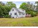 Exterior view of a charming home featuring a wooden deck for outdoor entertaining at 5601 Buffaloe Rd, Raleigh, NC 27616