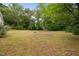 Expansive backyard showcasing mature trees and plenty of open space at 5601 Buffaloe Rd, Raleigh, NC 27616