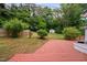 Large deck with a view to the storage shed and private backyard surrounded by trees at 5601 Buffaloe Rd, Raleigh, NC 27616