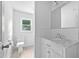 This bathroom is modernized with white cabinets, marble countertops and subway tile at 5601 Buffaloe Rd, Raleigh, NC 27616