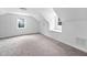 Bedroom featuring carpet floor, a window, and sloped ceilings at 5601 Buffaloe Rd, Raleigh, NC 27616