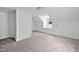 Bright bedroom featuring carpet, white walls, and natural lighting, creating a serene and inviting space at 5601 Buffaloe Rd, Raleigh, NC 27616
