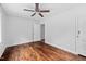 Bedroom features a wooden floor, ceiling fan, closet and a neutral color scheme at 5601 Buffaloe Rd, Raleigh, NC 27616