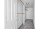 Walk-in closet with wooden racks and shelves offering optimal storage and organization, maximizing space efficiency at 5601 Buffaloe Rd, Raleigh, NC 27616